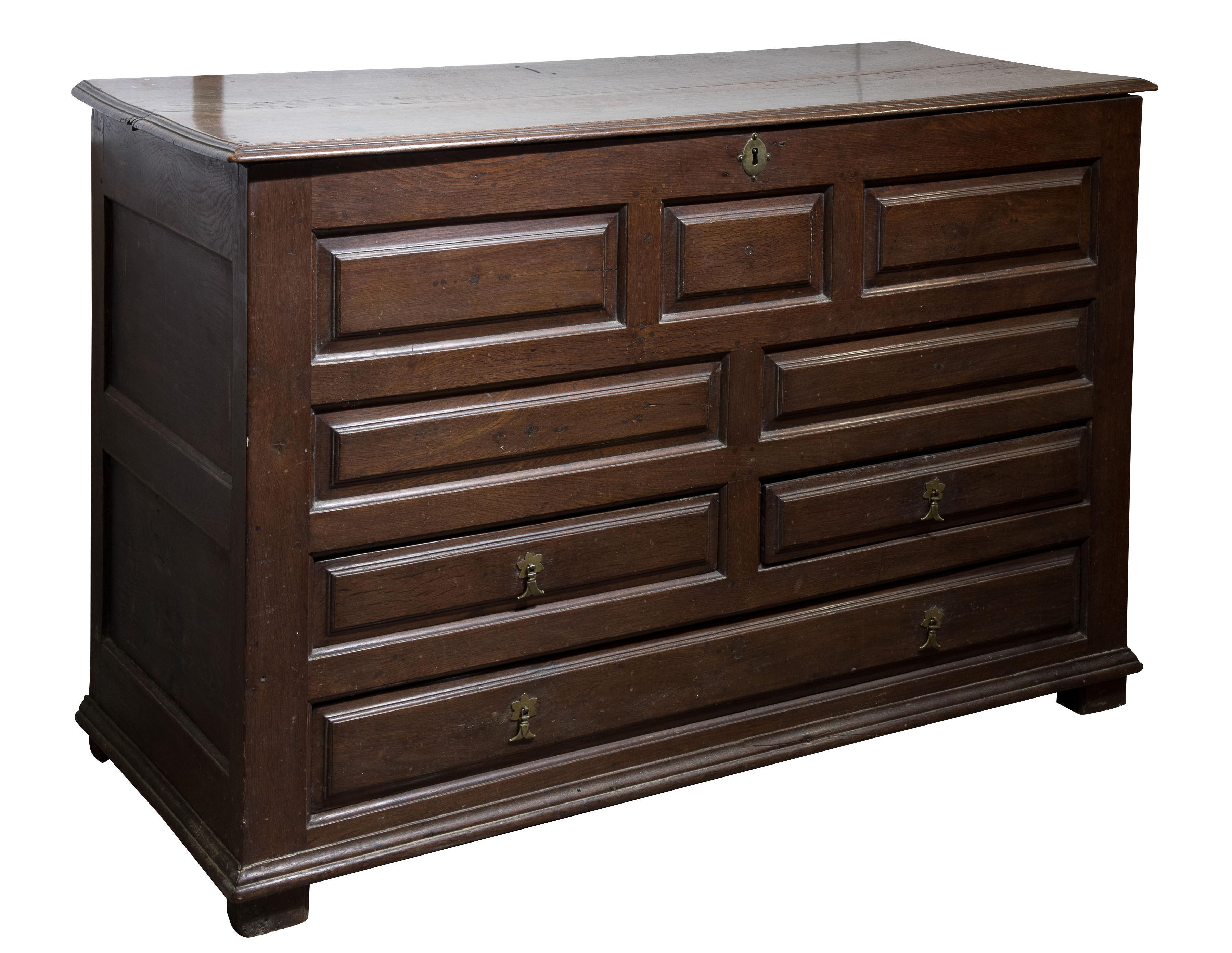 An early 18thC panelled oak mule chest with three drawers beneath (1 of 1)