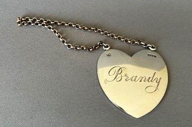 Unusual Heart Shaped Silver Brandy Label (1 of 4)