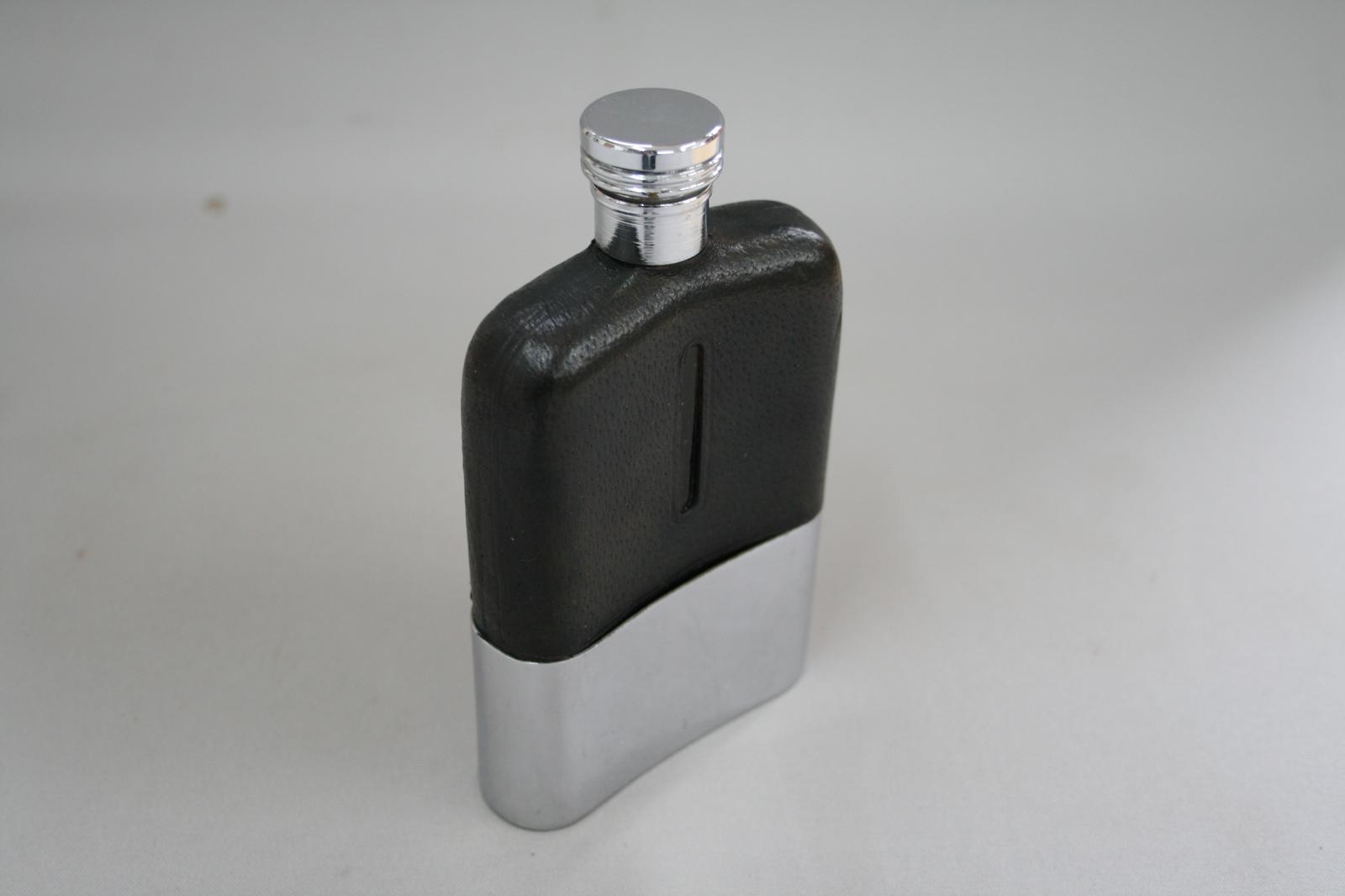 A Silver Plated And leather Covered Glass Hip Flask (1 of 4) A Silver Plated And leather Covered Glass Hip Flask (1 of 4)
