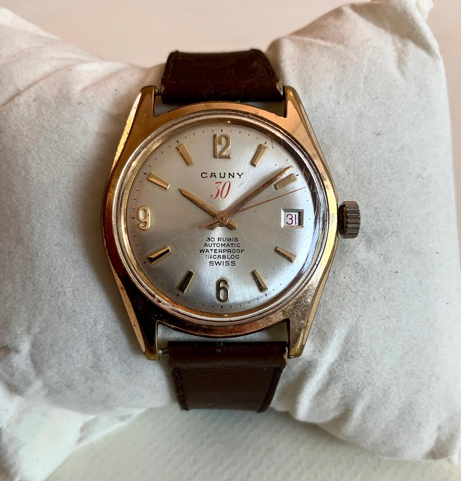 1950's Cauny Men's Wrist Watch 30 Rubis + Date Display + Leather Case Waterproof (1 of 5) 1950's Cauny Men's Wrist Watch 30 Rubis + Date Display + Leather Case Waterproof (1 of 5)