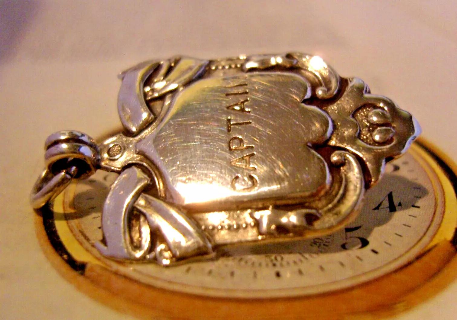Pocket Watch Chain Fob Silver 1920s Inscribed 'Captain' Antique Shield Fob (1 of 8) Pocket Watch Chain Fob Silver 1920s Inscribed 'Captain' Antique Shield Fob (1 of 8)