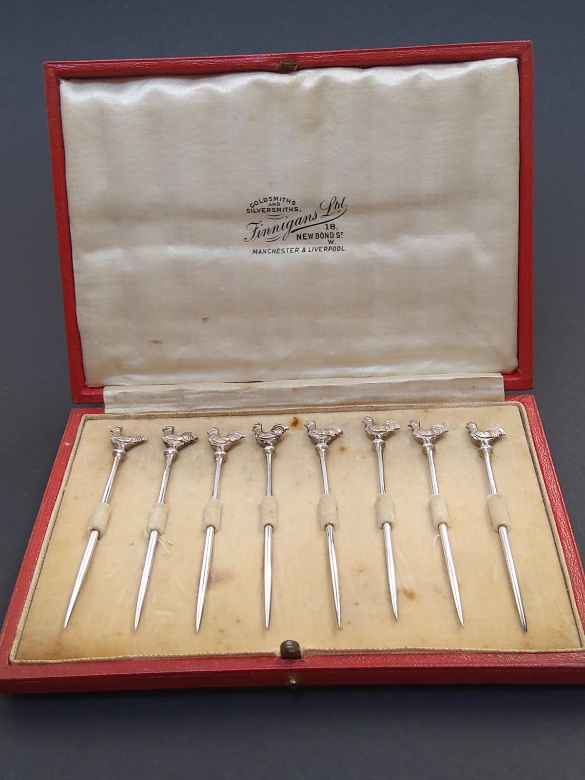 A Set of Eight Metal Silver Coloured Cocktail Sticks Mounted by a Cockral (1 of 4)