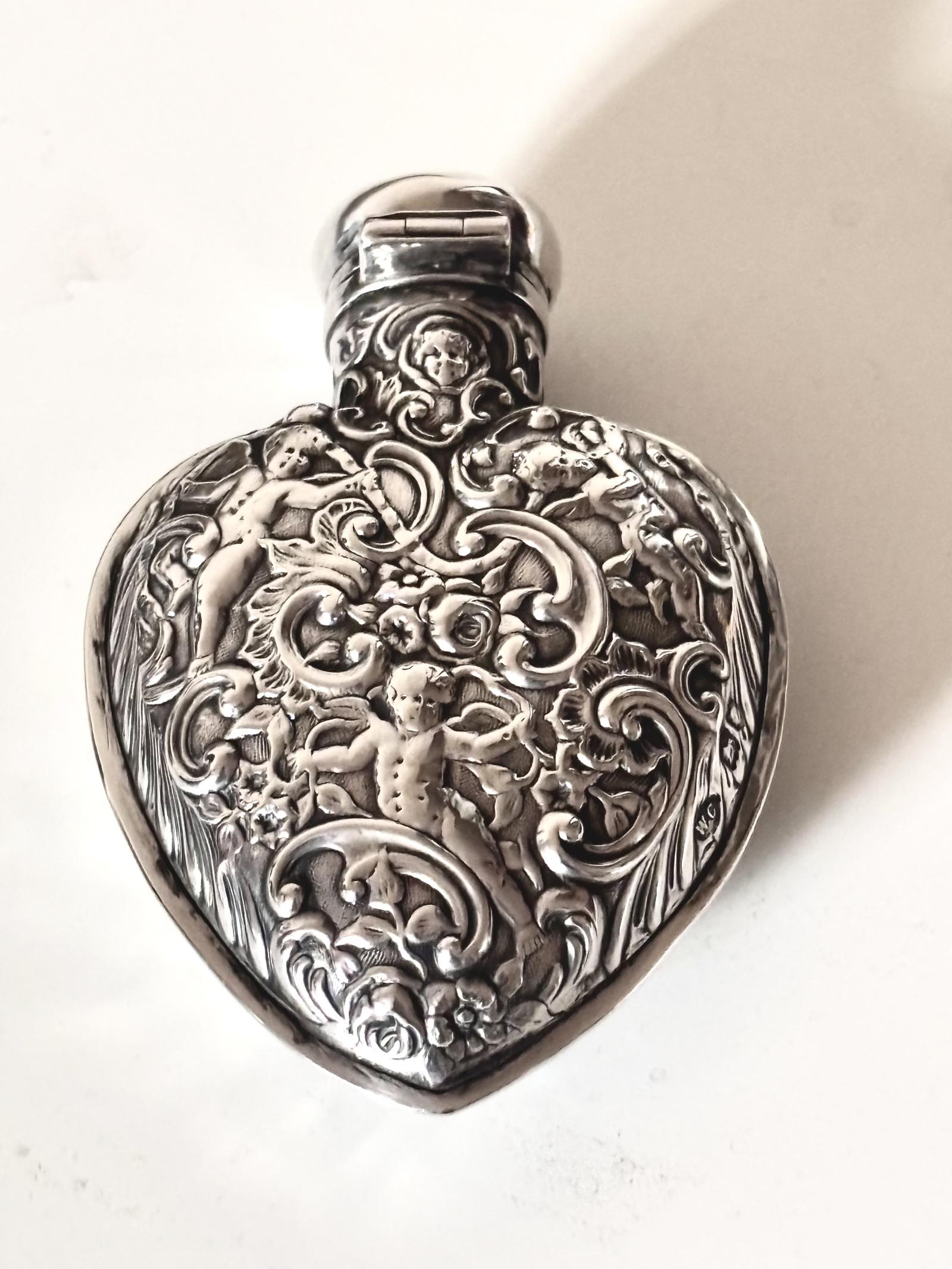 Victorian HM Silver Heart-shaped Scent Perfume Bottle London 1889 WILLIAM COMYNS (1 of 18) Victorian HM Silver Heart-shaped Scent Perfume Bottle London 1889 WILLIAM COMYNS (1 of 18)