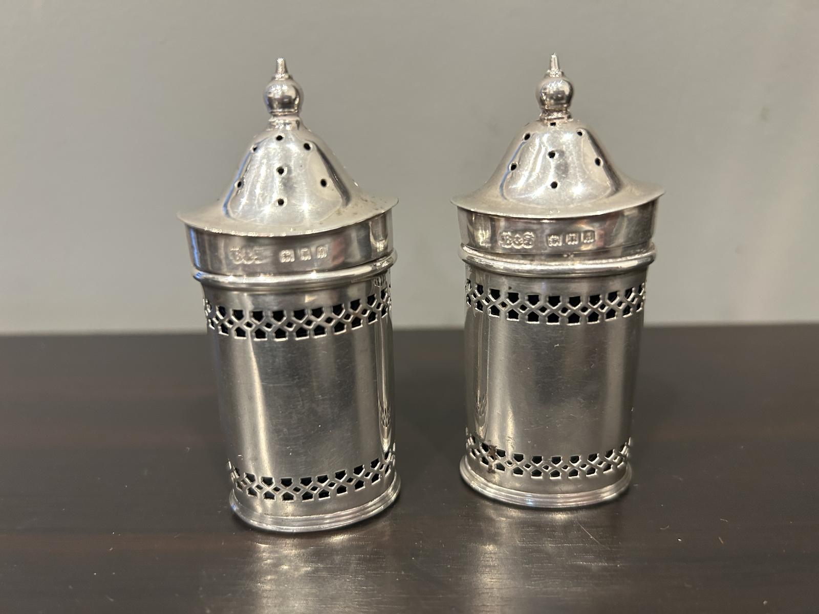 A Pair of Silver Pepperettes with Blue Glass Liners Reid & Sons London 1921 (1 of 13) A Pair of Silver Pepperettes with Blue Glass Liners Reid & Sons London 1921 (1 of 13)