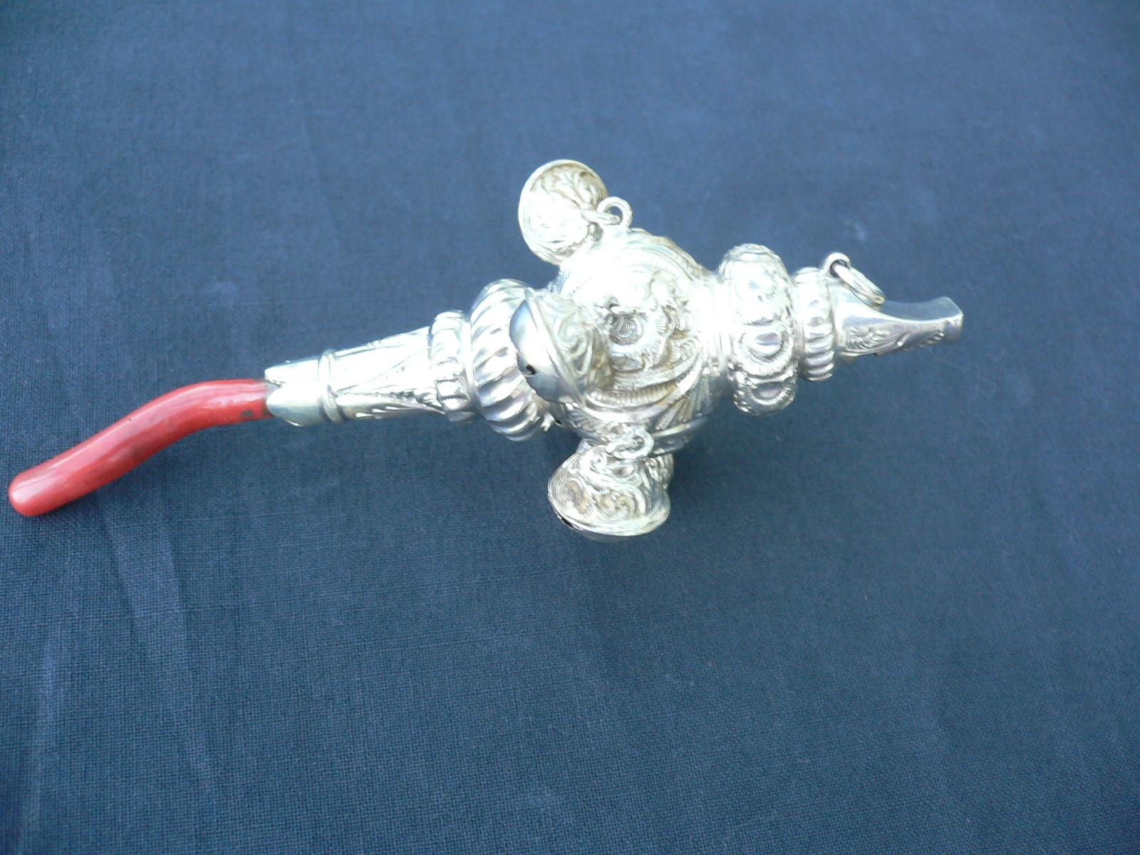 Baby rattle with coral handle (1 of 1)