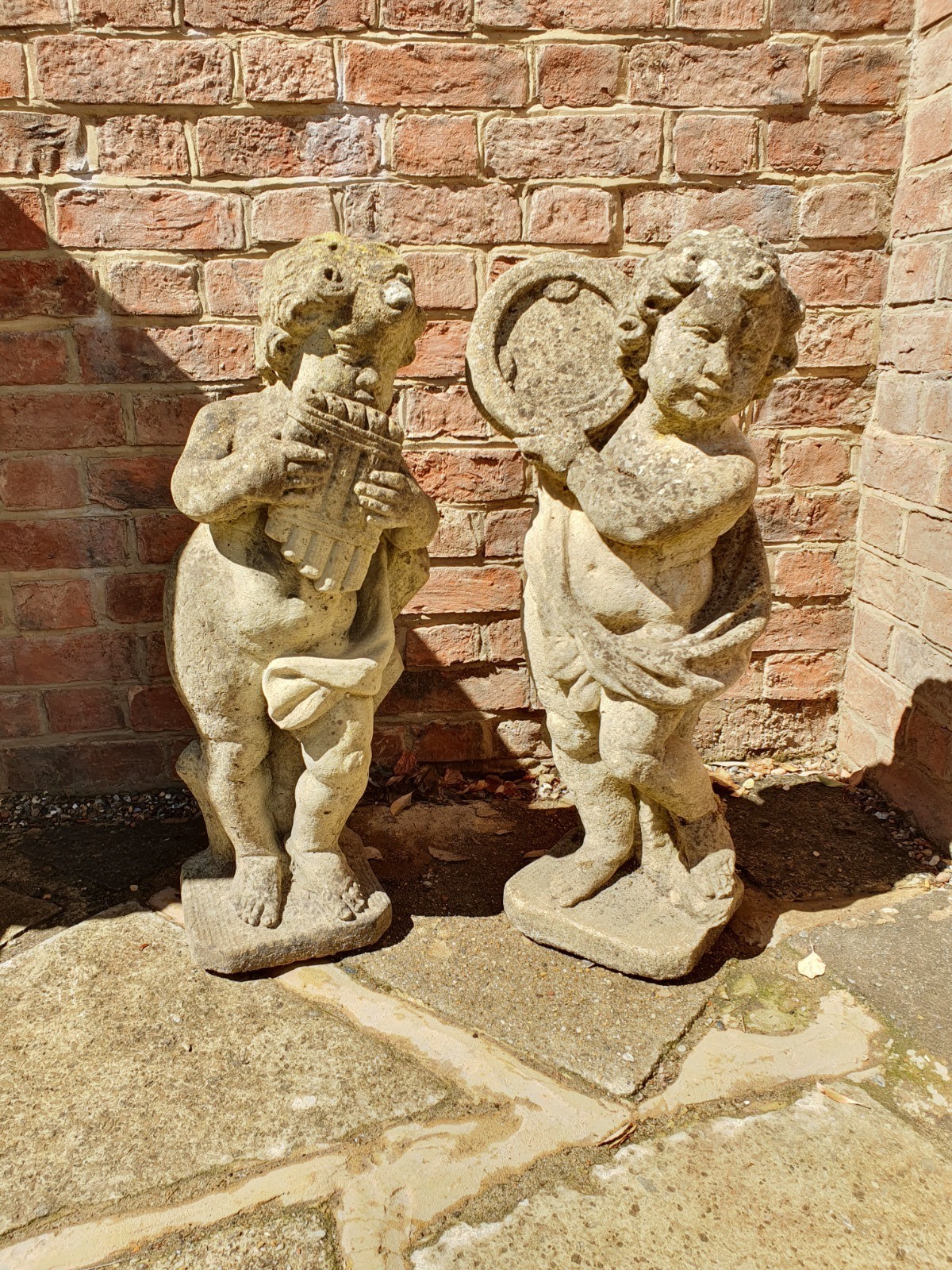 Pair of Reconstituted Stone Statues of Putti Playing Musical Instruments (1 of 7) Pair of Reconstituted Stone Statues of Putti Playing Musical Instruments (1 of 7)