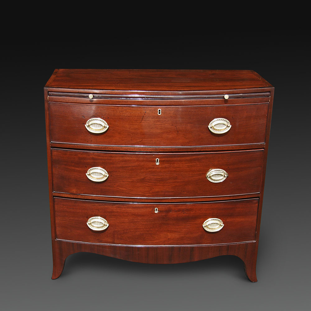A Small Bow Front Chest of Drawers (1 of 1)