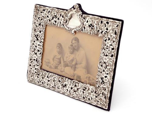 Late Victorian Silver Photo Frame Embossed and Pierced with Scrolls and Floral Scenes (1 of 5) Late Victorian Silver Photo Frame Embossed and Pierced with Scrolls and Floral Scenes (1 of 5)