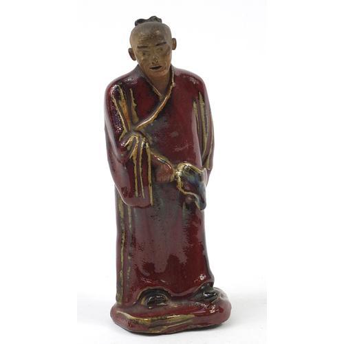 Chinese Porcelain Figure of a Monk Having a sang de boeuf Glaze (1 of 6)