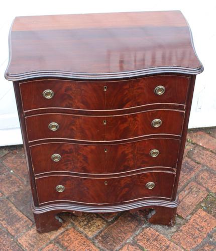 1900's Quality Mahogany Serpentine Chest Drawers + Flame Veneer on Bracket feet (1 of 4)