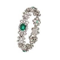 Ladies Bracelet in Platinum with Emeralds and Diamonds. First Quarter of the 20th Century.