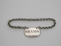 George III Silver "Boudoir Label" 'brandy', By Elizabeth Morley, London, 1813 (2 of 5) George III Silver "Boudoir Label" 'brandy', By Elizabeth Morley, London, 1813 (2 of 5)