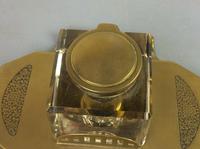 Art Deco brass and glass inkwell, the hinged brass lid above a clear glass body and brass base with two pen trays and engraved foliate scroll decoration, (5 of 12) Art Deco brass and glass inkwell, the hinged brass lid above a clear glass body and brass base with two pen trays and engraved foliate scroll decoration, (5 of 12)