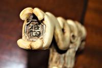 A finely carved large and chunky Chinese bone walking stick depicting a dragon with a loose ball in its mouth (6 of 6) A finely carved large and chunky Chinese bone walking stick depicting a dragon with a loose ball in its mouth (6 of 6)
