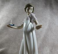 "Nina Con Palmatora" or "To Light The Way" Hand Modelled Porcelain Figure by Nao (2 of 8) "Nina Con Palmatora" or "To Light The Way" Hand Modelled Porcelain Figure by Nao (2 of 8)