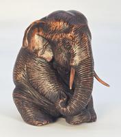 A Raj Period Indian Carved Study of a Seated Elephant