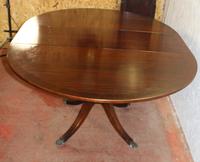 1960s Mahogany Round Table with One Leaf which Folds under Table (2 of 4) 1960s Mahogany Round Table with One Leaf which Folds under Table (2 of 4)