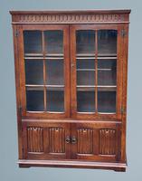 An Oak Two Door Linen Fold Bookcase