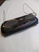 Pair of Doctor's wire rimmed glasses with wrap around arms (2 of 3) Pair of Doctor's wire rimmed glasses with wrap around arms (2 of 3)
