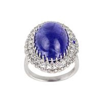 Ring in 18K white gold with tanzanite, cabochon cut, and loose diamonds.