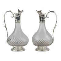 Pair of French, spiral glass wine jugs with silver. Late 19th century.