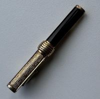1970s Christian Dior Gold Plated Onyx Tie Clip