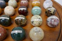 Set of French Marble Orbs on a Turned Solitaire Board (5 of 9) Set of French Marble Orbs on a Turned Solitaire Board (5 of 9)